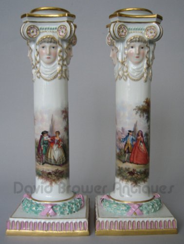 A pair of Meissen candlesticks with liners