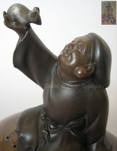 A Japanese bronze koro surmounted by Daikoku