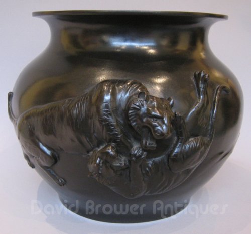 A Japanese bronze jardiniere of tigers