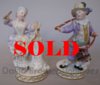 Pair of Meissen Figures, girl with a doll and boy with hobby horse
